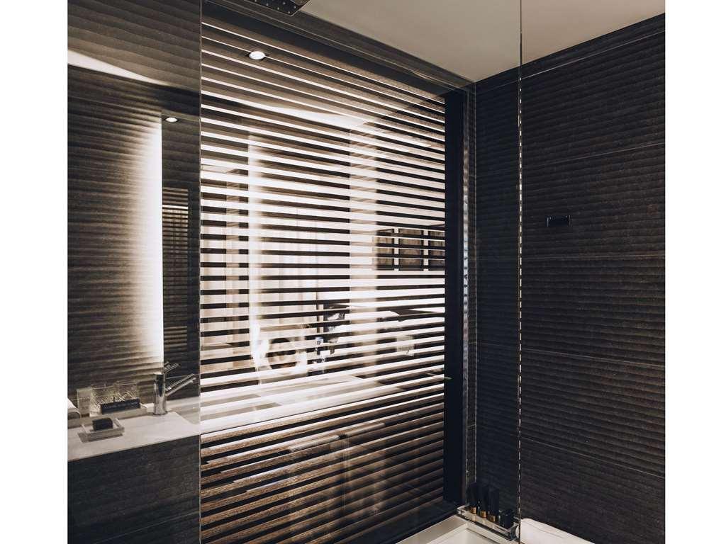 Sls Buenos Aires Puerto Madero Hotel Room photo A shower enclosure with a fixed glass panel